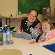 Two female ISW's post for a photo